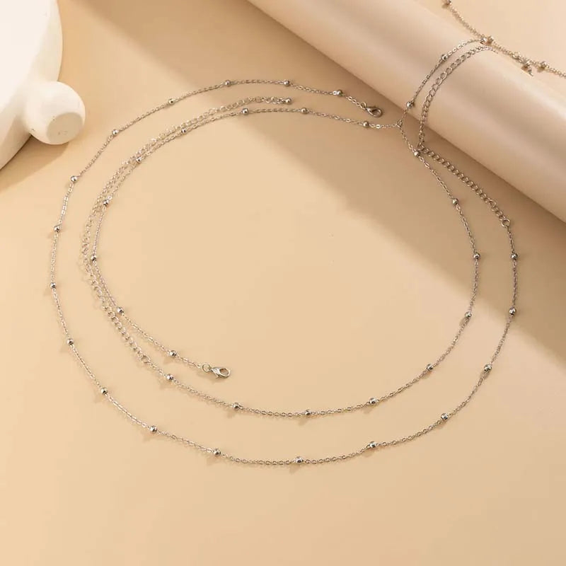 Bijou de taille argenté à perles pour tenue de soirée